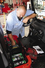 A technician preps a new electric UTV purchased by the regional airport in Springfield, Mo. The airport will use it for transportation inside the terminal. A technician preps a new electric UTV purchased by the regional airport in Springfield, Mo. The airport will use it for transportation inside the terminal.
